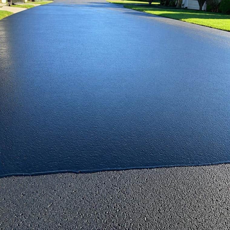 Close-up of cracked asphalt pavement surface before repair